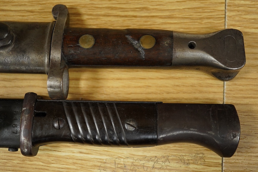 Three various bayonets and scabbards including one Sandersons of Sheffield, longest 44cm. Condition - fair